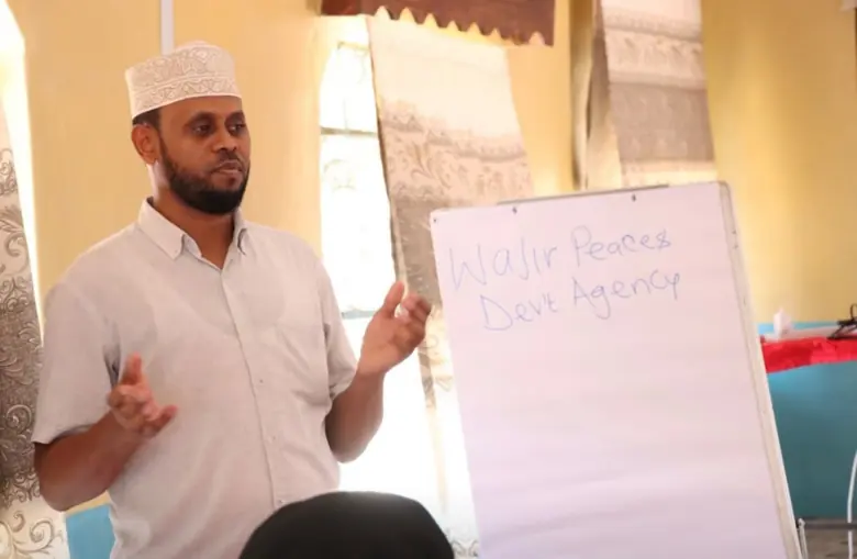 A facilitator with a flip chart at a training